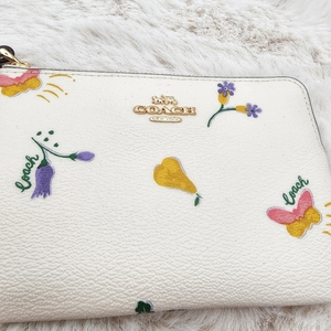 Coach‎ wristlet with beet charm brand new with tags! Cute unique veggie design.